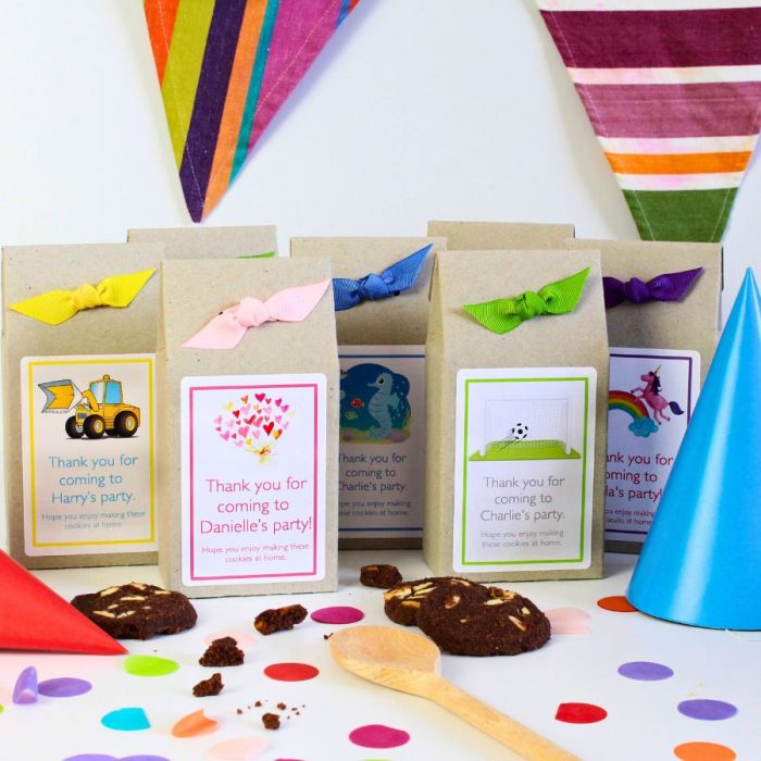 Group of kids personalised baking mix party bags with freshly baked cookies