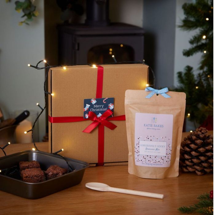 Christmas brownie baking gift set with brownie mix, tin, spoon, and festive gift box.