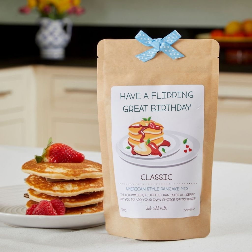 Personalised American style pancake mix pouch with ribbon and stack of pancakes