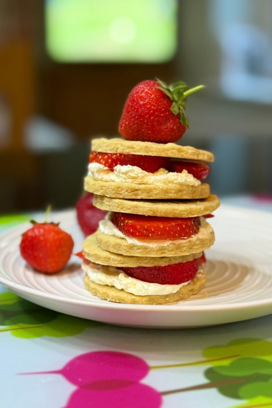 Strawberry Shortbread stack of shortbread biscuits layered with whipped cream and strawberries